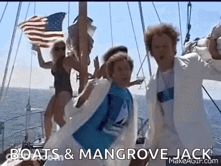 A Group Of People Are Dancing On A Boat In The Ocean While Holding An American Flag . GIF