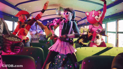 A Group Of People Are Dancing On A Bus And One Of Them Is Wearing A Teddy Bear Costume GIF