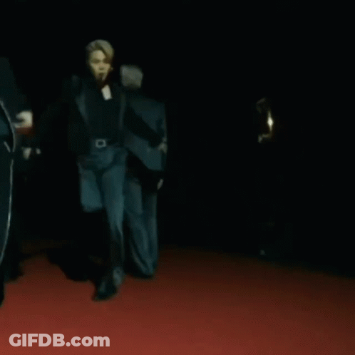 A Group Of People Are Dancing On A Red Carpet GIF
