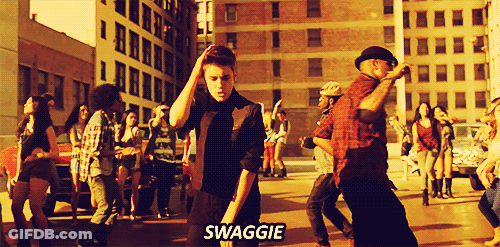 A Group Of People Are Dancing On The Street And The Word Swagge Is On The Bottom GIF