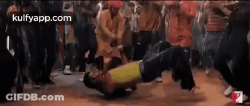 A Group Of People Are Dancing Together In A Club . GIF