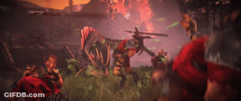 A Group Of People Are Fighting A Monster In A Field GIF