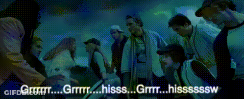 A Group Of People Are Gathered In A Dark Room With The Words " Grrr " Written On The Bottom GIF