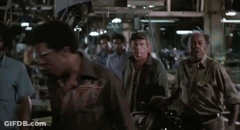 A Group Of People Are Gathered In A Room And The Words Blue Collar Are Visible GIF