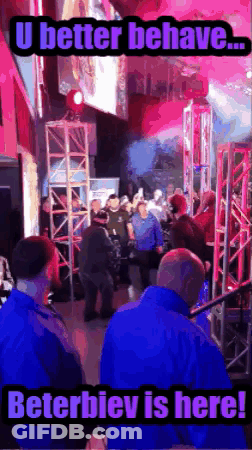 A Group Of People Are Gathered In A Room With A Caption That Says U Better Behave Beterbiev Is Here GIF