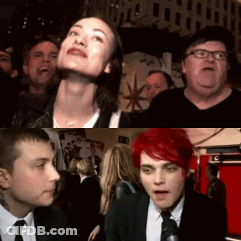 A Group Of People Are Gathered In A Room With A Sign That Says C On It GIF