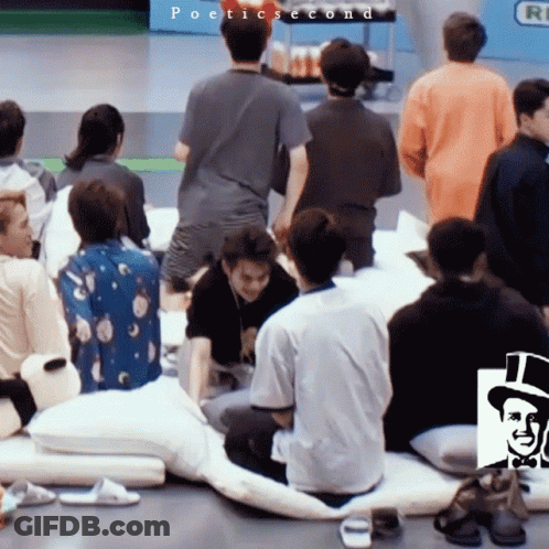 A Group Of People Are Gathered In A Room With The Words Poetic Second On The Bottom Left GIF