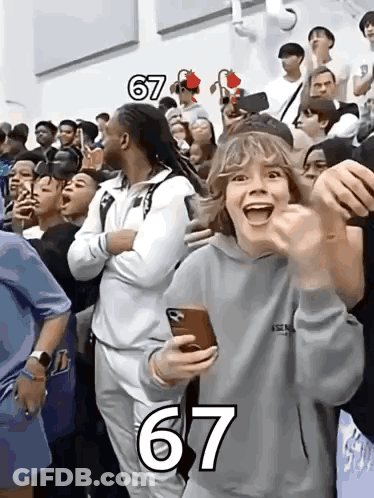 A Group Of People Are Gathered In A Stadium With The Number 67 On The Bottom GIF