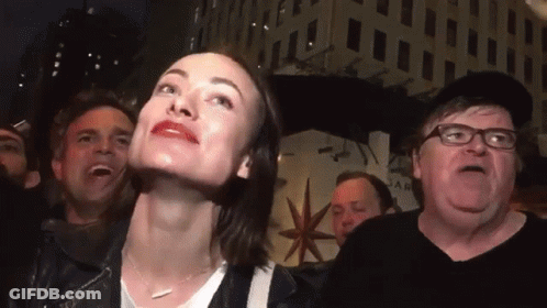A Group Of People Are Gathered In Front Of A Building That Says Star On It GIF