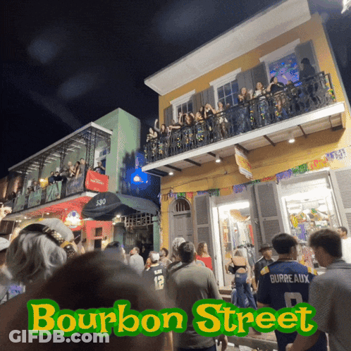 A Group Of People Are Gathered Outside Of A Building That Says Bourbon Street GIF