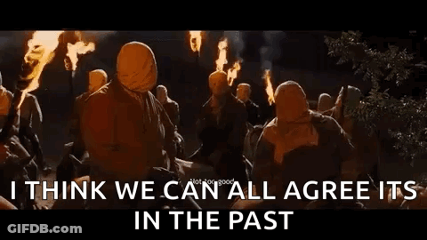 A Group Of People Are Holding Torches In Their Hands And Standing Around A Fire At Night . GIF