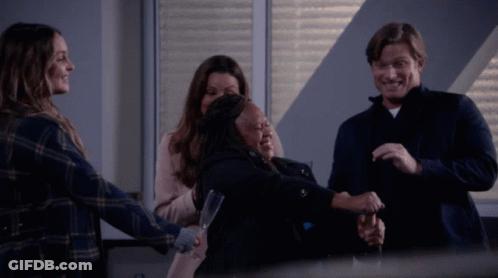 Group Hug With One Holding Glass GIF