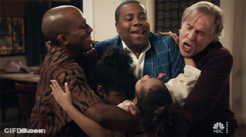 A Group Of People Are Hugging Each Other With A Nbc Logo In The Corner GIF