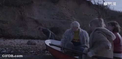 A Group Of People Are In A Boat With A Netflix Logo In The Corner . GIF