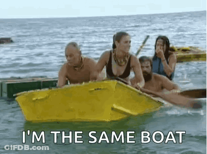 A Group Of People Are In A Yellow Boat In The Ocean . GIF