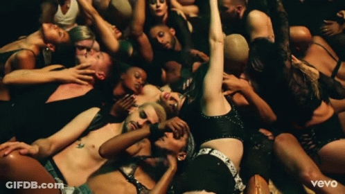 A Group Of People Are Laying On The Floor With The Word Vevo On The Bottom Right GIF