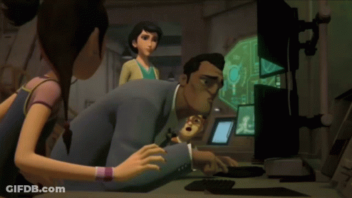 A Group Of People Are Looking At A Computer Screen With A Key On It GIF