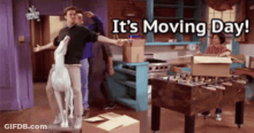 A Group Of People Are Moving Into A House With The Words It 'S Moving Day Written Above Them GIF
