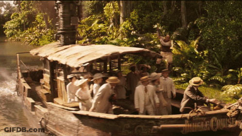 A Group Of People Are On A Boat Called The Jungle Cruise GIF