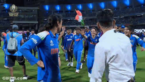 A Group Of People Are On A Field And One Of Their Shirts Has The Word India On It GIF