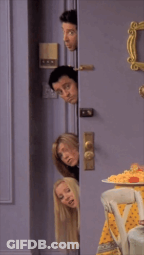 A Group Of People Are Peeking Out Of A Door GIF