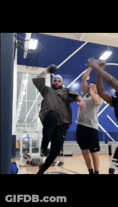A Group Of People Are Playing A Game Of Basketball GIF