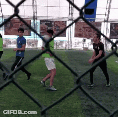 A Group Of People Are Playing A Game Of Soccer GIF