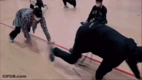 A Group Of People Are Playing A Game On A Basketball Court And One Of Them Is Wearing A Mask That Says Nfc GIF