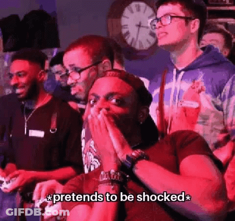 A Group Of People Are Playing A Video Game And One Of Them Is Covering His Mouth . GIF