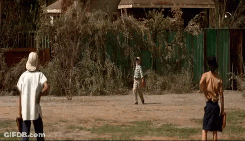 A Group Of People Are Playing Baseball In A Field GIF