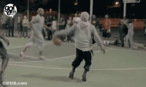 A Group Of People Are Playing Basketball On A Court With A Logo That Says Go Em GIF