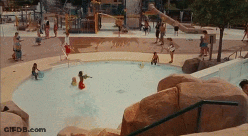 A Group Of People Are Playing In A Pool With The Word Turbo On The Ground GIF