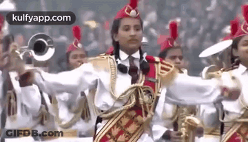 A Group Of People Are Playing Instruments In A Band . GIF