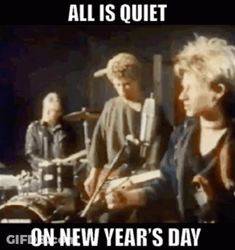 A Group Of People Are Playing Instruments On A Stage And They Are All Quiet On New Year 'S Day . GIF