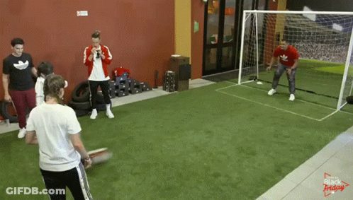 A Group Of People Are Playing Soccer In A Room That Says Black Friday On It GIF