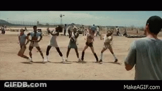 A Group Of People Are Playing Volleyball On A Dirt Field While A Man Watches . GIF