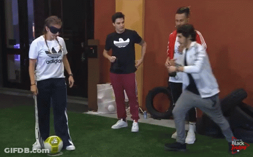A Group Of People Are Playing With A Soccer Ball And One Of Them Is Wearing An Adidas Shirt GIF