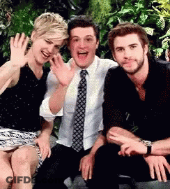 A Group Of People Are Posing For A Picture Together . GIF