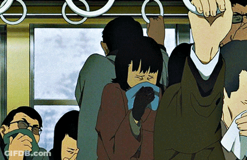 A Group Of People Are Riding A Bus And One Of Them Is Covering Her Mouth GIF