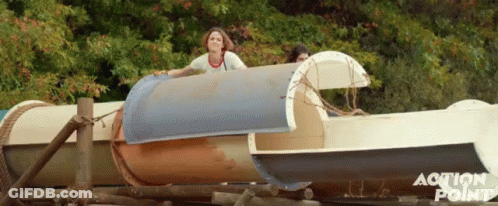 A Group Of People Are Riding A Water Slide And The Words Action Point Are On The Bottom GIF