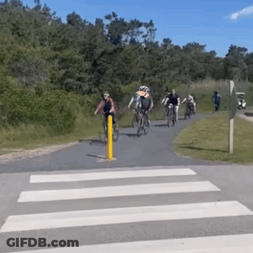 People Riding Bicycles On Trail GIF