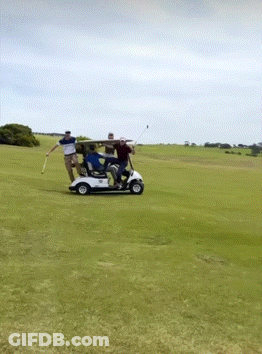A Group Of People Are Riding In A Golf Cart GIF