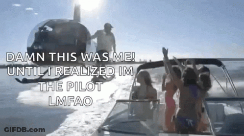 A Group Of People Are Riding On A Boat In The Water With A Helicopter Flying In The Background . GIF