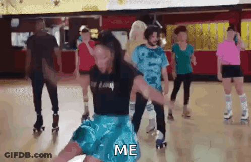A Group Of People Are Rollerblading In A Roller Rink And One Of Them Is Holding Another Person 'S Arm . GIF