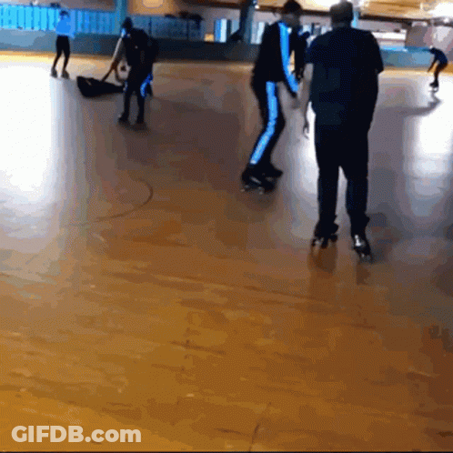 A Group Of People Are Rollerblading On A Roller Rink GIF