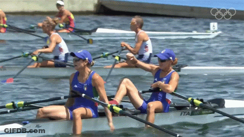A Group Of People Are Rowing A Boat With The Number 8 On The Back GIF
