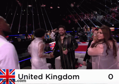 A Group Of People Are Shaking Hands In Front Of A Crowd With United Kingdom Written On The Bottom GIF