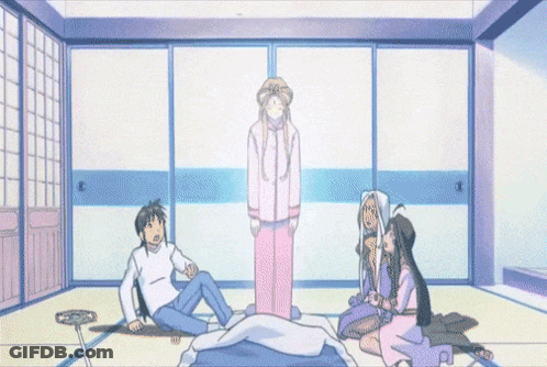A Group Of People Are Sitting Around A Bed With A Ghost In The Background GIF