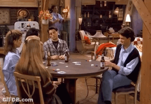 A Group Of People Are Sitting Around A Table Playing Cards With Bottles Of Beer . GIF