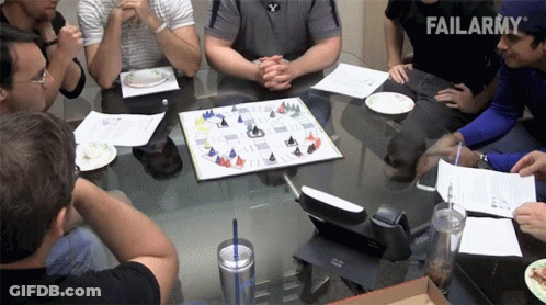 A Group Of People Are Sitting Around A Table With A Failarmy Logo In The Background GIF